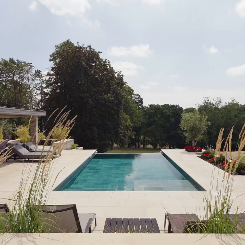 Along the pool, pool house, wide with flowers